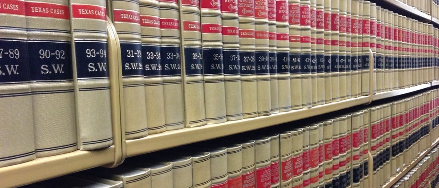 Legal books on a shelf, illustrating a law firm website