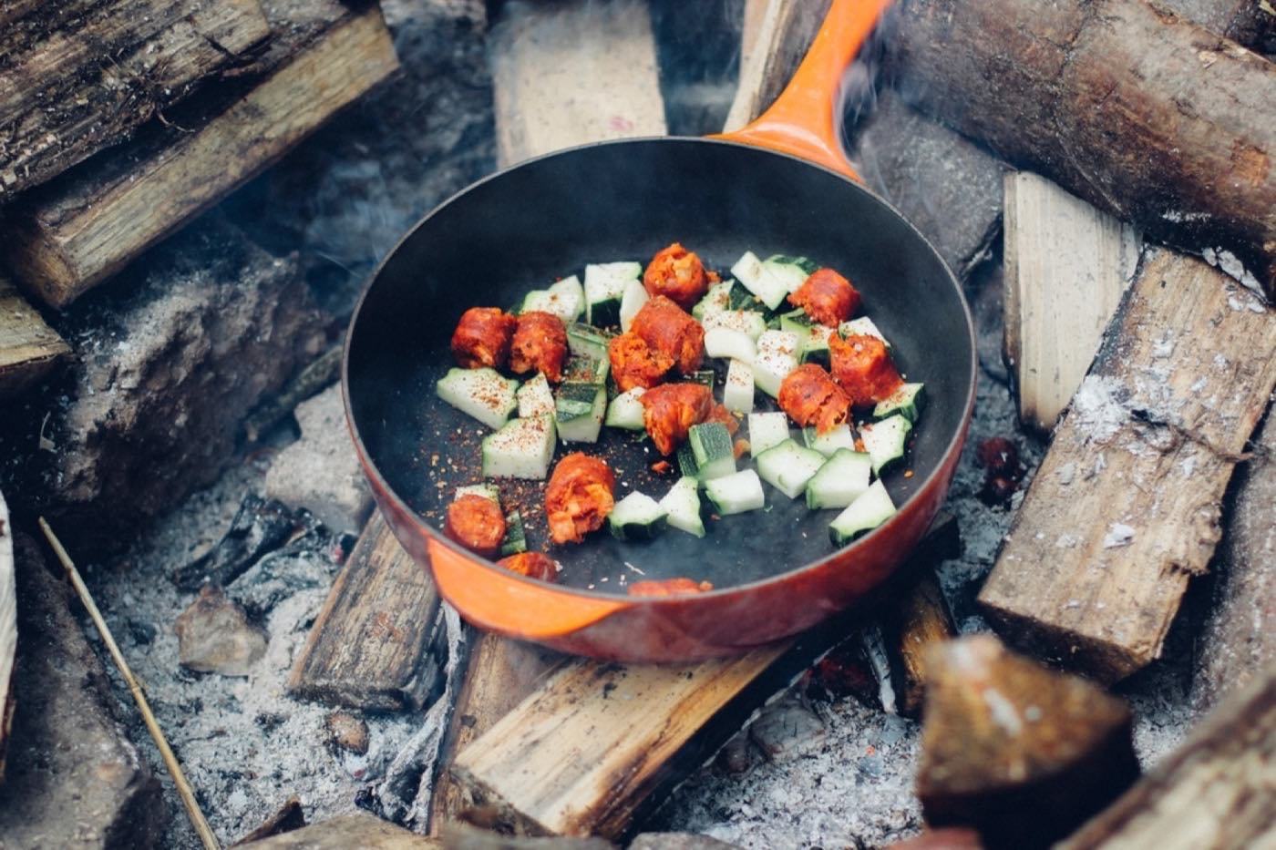A pan cooking on a hob, illustrating premium e-commerce product marketing