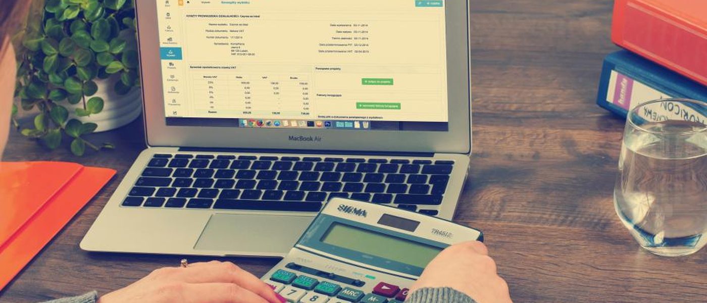 A calculator and paperwork on a desk, illustrating accountancy SEO