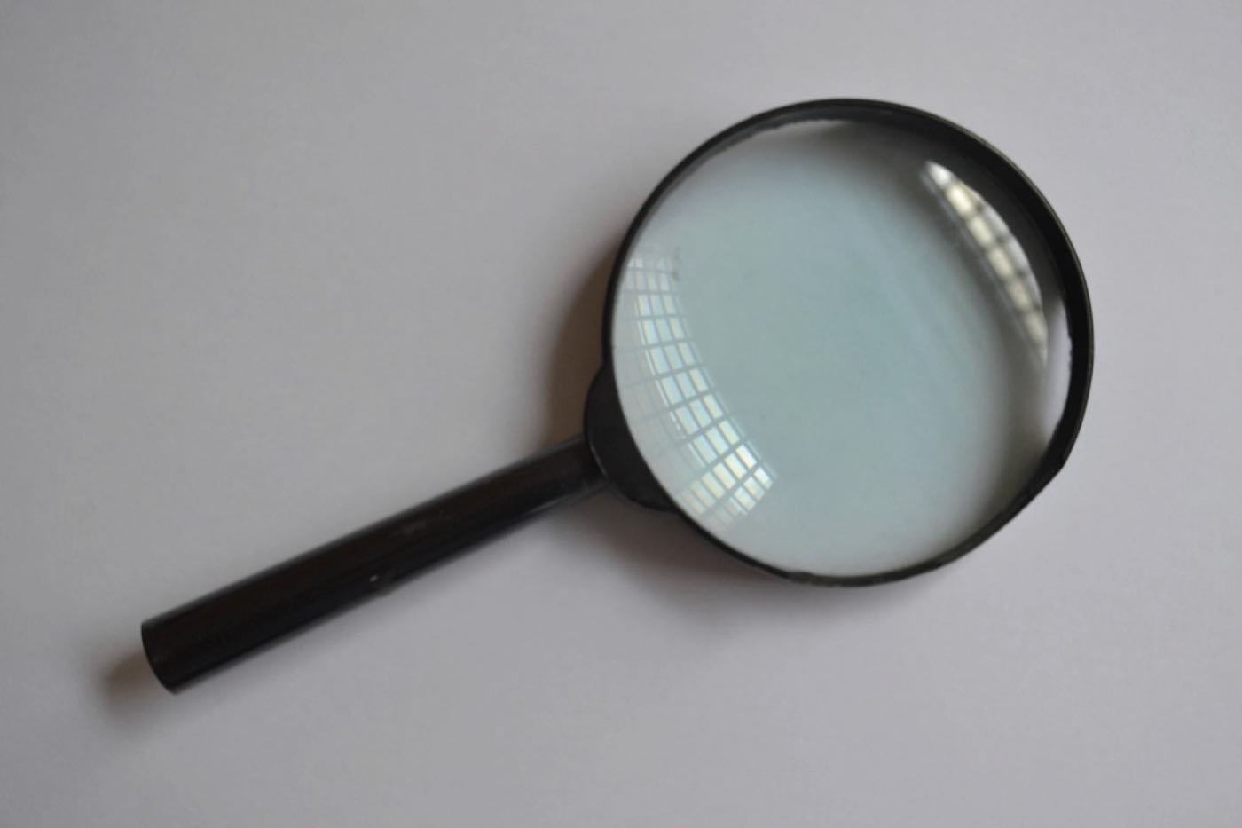 A magnifying glass, illustrating why a website is not ranking on Google